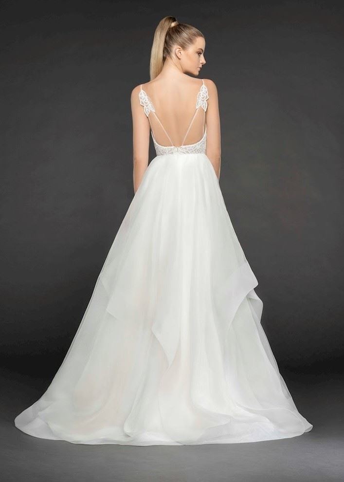 Bride wearing strappy back wedding dress