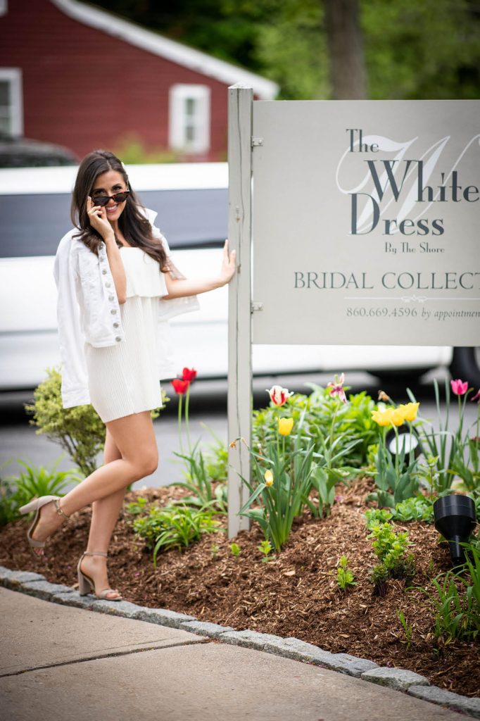 The White Dress by the shore sign and Marisa Hunter