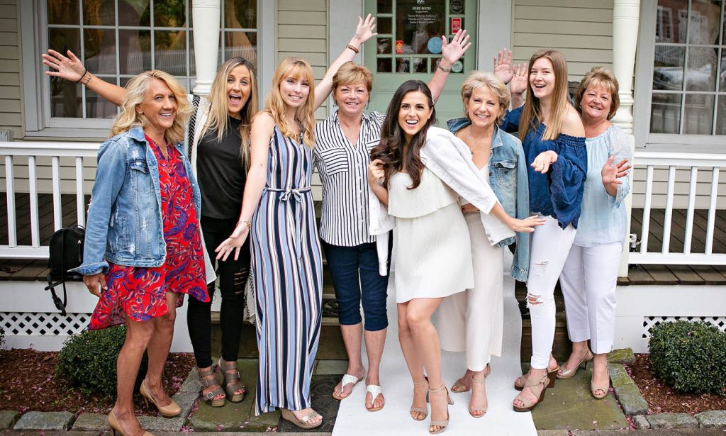 The Bridal Party outside of The White Dress by the shore