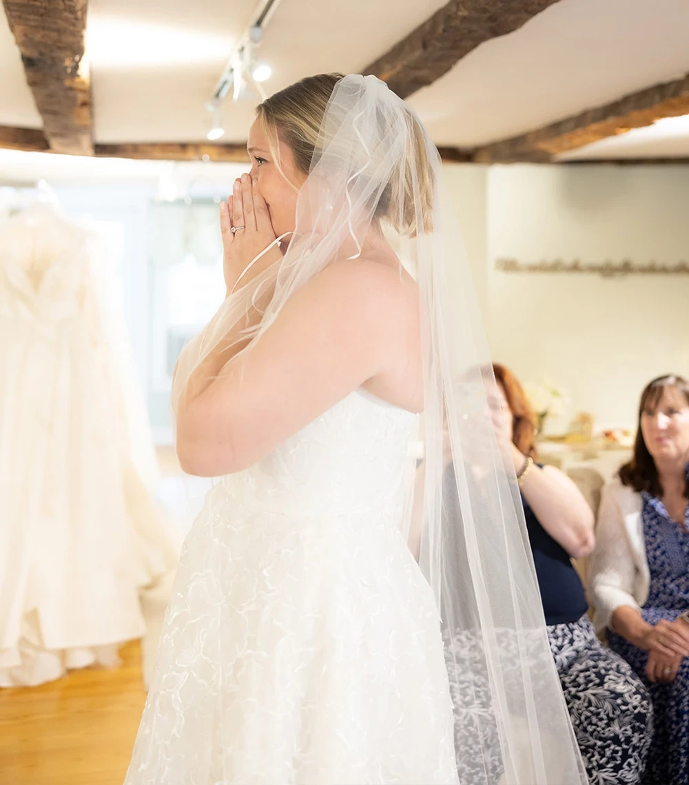 Model wearing a bridal white gown