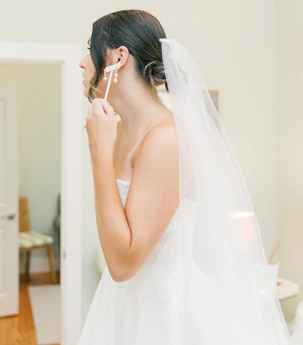 Model wearing a bridal white gown