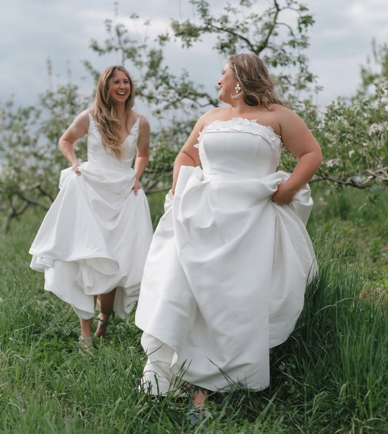 Сouple wearing a white gown and a black suit