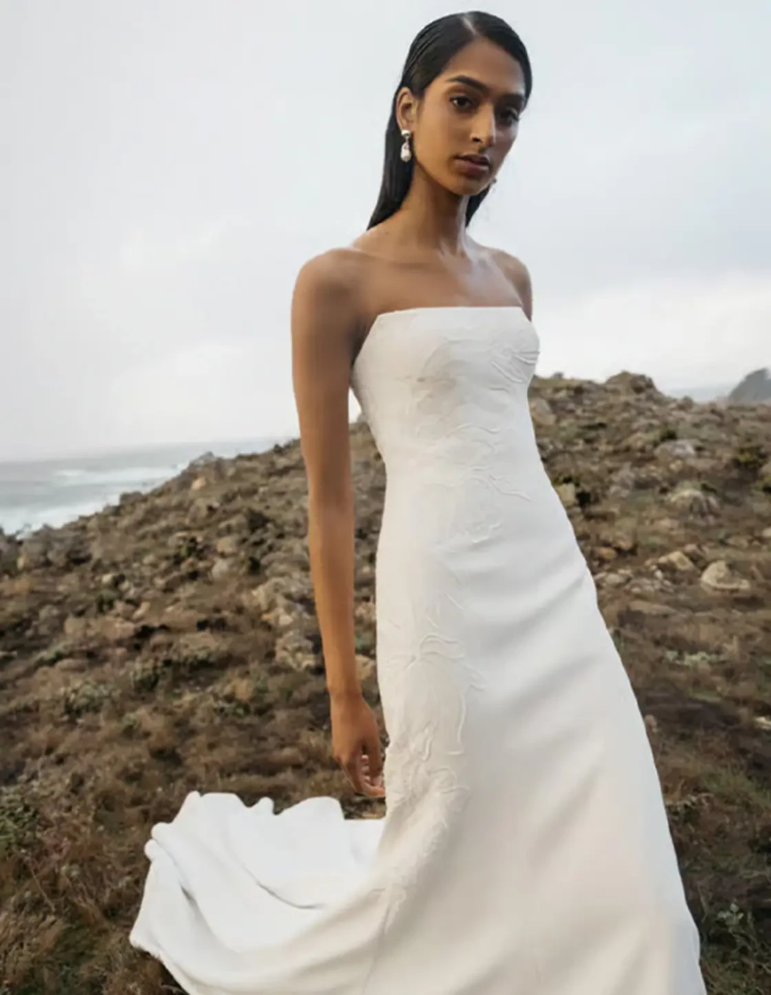 Model wearing a strapless bridal gown
